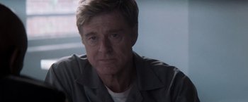 Movie still from “The Last Castle” (2001), directed by Rod Lurie – A person wearing a gray shirt; Close Up shot, Over the shoulder angle