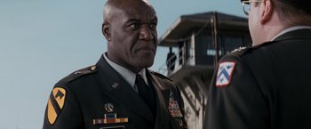 Movie still from “The Last Castle” (2001), directed by Rod Lurie – A person wearing a military uniform; Close Up shot, Low angle