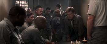 Movie still from “The Last Castle” (2001), directed by Rod Lurie – A group of men standing next to each other in a room; Medium shot, Over the shoulder angle