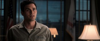 Movie still from “The Last Castle” (2001), directed by Rod Lurie – A man standing in front of a window in a room; Close Up shot, Over the shoulder angle