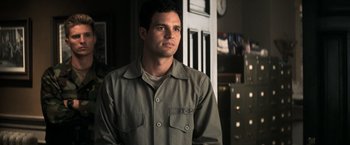 Movie still from “The Last Castle” (2001), directed by Rod Lurie – A man standing in front of an open door; Medium shot, Over the shoulder angle