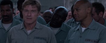 Movie still from “The Last Castle” (2001), directed by Rod Lurie – A group of men standing next to each other in a room; Close Up shot, Over the shoulder angle