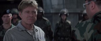 Movie still from “The Last Castle” (2001), directed by Rod Lurie – A man standing in front of a group of soldiers; Close Up shot, Over the shoulder angle
