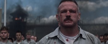 Movie still from “The Last Castle” (2001), directed by Rod Lurie – A person with blood all over his face; Close Up shot, Low angle