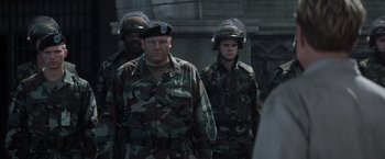 Movie still from “The Last Castle” (2001), directed by Rod Lurie – A group of men standing next to each other; Medium shot, Over the shoulder angle