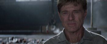 Movie still from “The Last Castle” (2001), directed by Rod Lurie – A person wearing a white shirt; Close Up shot, Over the shoulder angle