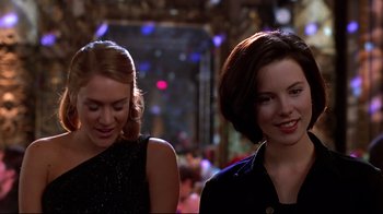 Movie still from “The Last Days of Disco” (1998), directed by Whit Stillman – Two young women are walking together in a crowd; Close Up shot, Low angle