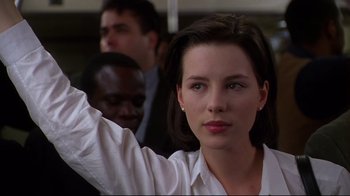Movie still from “The Last Days of Disco” (1998), directed by Whit Stillman – A woman that is standing in a bus; Close Up shot, Low angle