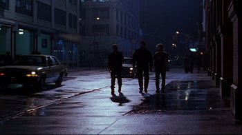 Movie still from “The Last Days of Disco” (1998), directed by Whit Stillman – A couple of people that are standing in the street; Wide shot, Low angle