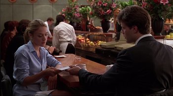 Movie still from “The Last Days of Disco” (1998), directed by Whit Stillman – A man and a woman sitting at a table; Medium shot, Over the shoulder angle