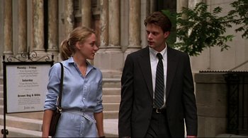 Movie still from “The Last Days of Disco” (1998), directed by Whit Stillman – A man and a woman standing next to each other; Medium shot, Low angle