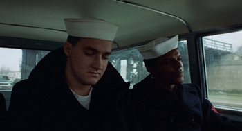 Movie still from “The Last Detail” (1973), directed by Hal Ashby – Two sailors in a car looking out the front window; Close Up shot, High angle