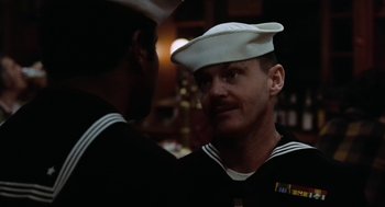 Movie still from “The Last Detail” (1973), directed by Hal Ashby – Two sailors are talking to each other in the dark; Close Up shot, Over the shoulder angle