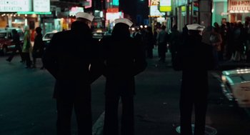 Movie still from “The Last Detail” (1973), directed by Hal Ashby – A group of people standing on the side of a road; Wide shot, Low angle
