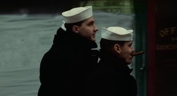 Movie still from “The Last Detail” (1973), directed by Hal Ashby – Two men in white hats and black jackets; Close Up shot, Low angle