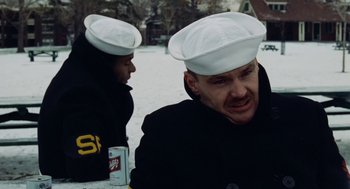 Movie still from “The Last Detail” (1973), directed by Hal Ashby – Two men in white hats sitting next to each other; Close Up shot, Over the shoulder angle
