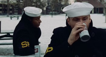 Movie still from “The Last Detail” (1973), directed by Hal Ashby – Two sailors are sitting at a table and eating; Medium shot, Low angle