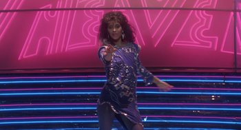 Movie still from “The Last Dragon” (1985), directed by Michael Schultz – A woman in a purple dress dancing on a stage; Wide shot, Low angle