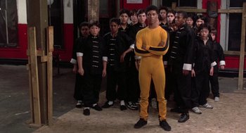 Movie still from “The Last Dragon” (1985), directed by Michael Schultz – A group of young men standing next to each other; Wide shot, Low angle