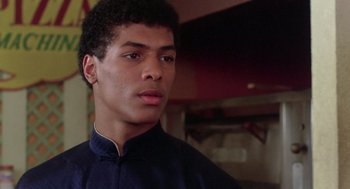 Movie still from “The Last Dragon” (1985), directed by Michael Schultz – A young man is looking at the camera; Close Up shot, Low angle
