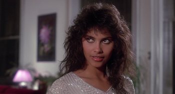 Movie still from “The Last Dragon” (1985), directed by Michael Schultz – A person with long hair; Close Up shot, Over the shoulder angle