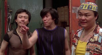 Movie still from “The Last Dragon” (1985), directed by Michael Schultz – A group of young men standing next to each other; Medium shot, Low angle