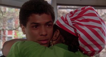 Movie still from “The Last Dragon” (1985), directed by Michael Schultz – A young man and a young woman hugging; Close Up shot, Over the shoulder angle