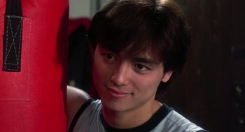 Movie still from “The Last Dragon” (1985), directed by Michael Schultz – A person wearing a shirt; Close Up shot, Low angle