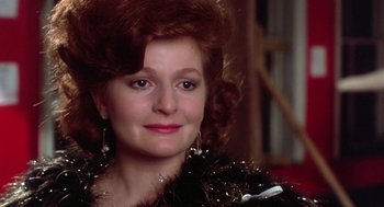 Movie still from “The Last Dragon” (1985), directed by Michael Schultz – A person wearing a dress; Close Up shot, Over the shoulder angle