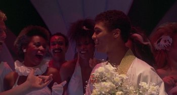 Movie still from “The Last Dragon” (1985), directed by Michael Schultz – A group of young people standing next to each other; Medium shot, Low angle