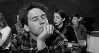 Movie still from “The Last Picture Show” (1971), directed by Peter Bogdanovich – A man and two women sitting next to each other; Close Up shot, Over the shoulder angle