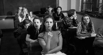Movie still from “The Last Picture Show” (1971), directed by Peter Bogdanovich – Black and white photograph of a group of young people; Medium shot, High angle