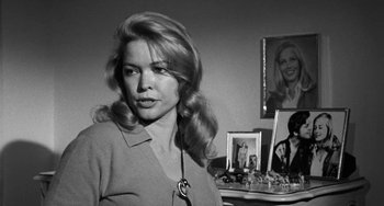 Movie still from “The Last Picture Show” (1971), directed by Peter Bogdanovich – Black and white photograph of a woman in front of a mirror; Close Up shot, Over the shoulder angle