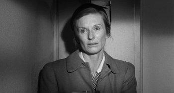 Movie still from “The Last Picture Show” (1971), directed by Peter Bogdanovich – An old photo of a woman in a coat and tie; Close Up shot, Over the shoulder angle