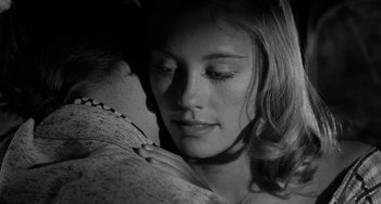 Movie still from “The Last Picture Show” (1971), directed by Peter Bogdanovich – A young woman with her head resting on a pillow; Close Up shot, Over the shoulder angle