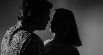 Movie still from “The Last Picture Show” (1971), directed by Peter Bogdanovich – A man and a woman face to face in a black and white photo; Close Up shot, Low angle