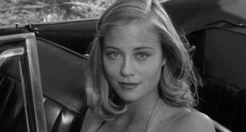 Movie still from “The Last Picture Show” (1971), directed by Peter Bogdanovich – A black and white photo of a woman in a car; Close Up shot, High angle
