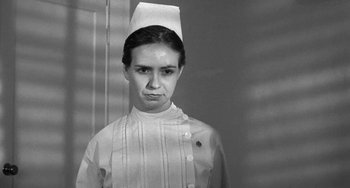 Movie still from “The Last Picture Show” (1971), directed by Peter Bogdanovich – A black - and - white photo of a woman in a nurse's uniform; Close Up shot, Low angle