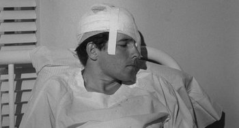 Movie still from “The Last Picture Show” (1971), directed by Peter Bogdanovich – A man with a bandage on his head; Close Up shot, High angle