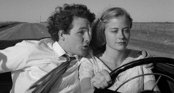 Movie still from “The Last Picture Show” (1971), directed by Peter Bogdanovich – A man and a woman sitting in a car; Close Up shot, Low angle