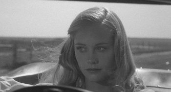 Movie still from “The Last Picture Show” (1971), directed by Peter Bogdanovich – A black - and - white photo of a woman in a car; Close Up shot, Over the shoulder angle