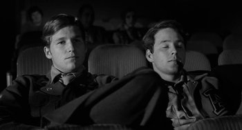 Movie still from “The Last Picture Show” (1971), directed by Peter Bogdanovich – Two young men sitting next to each other in a car; Close Up shot, Low angle