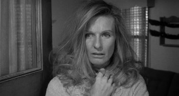 Movie still from “The Last Picture Show” (1971), directed by Peter Bogdanovich – A black and white photo of a woman with long hair; Close Up shot, Over the shoulder angle