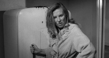 Movie still from “The Last Picture Show” (1971), directed by Peter Bogdanovich – A black and white photo of a woman in a bathrobe; Close Up shot, High angle