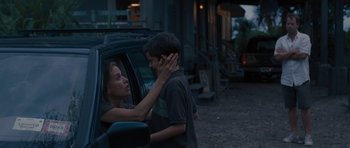 Movie still from “The Last Song” (2010), directed by Julie Anne Robinson – A woman and a boy in the back of a car; Medium shot, Over the shoulder angle