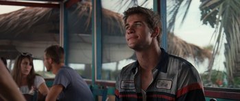 Movie still from “The Last Song” (2010), directed by Julie Anne Robinson – A young man is looking up at the sky; Close Up shot, Over the shoulder angle