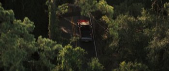 Movie still from “The Last Song” (2010), directed by Julie Anne Robinson – An aerial view of a truck driving down a road; Extreme Wide shot, High angle
