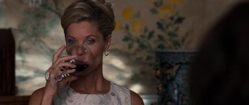 Movie still from “The Last Song” (2010), directed by Julie Anne Robinson – A woman holding a glass of red wine in her hand; Close Up shot, Over the shoulder angle
