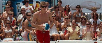 Movie still from “The Last Song” (2010), directed by Julie Anne Robinson – A group of people watching a man play frisbee; Medium shot, Low angle