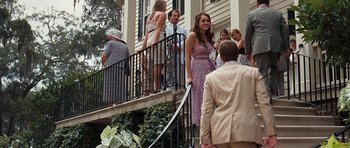 Movie still from “The Last Song” (2010), directed by Julie Anne Robinson – A group of people standing on the steps of a house; Wide shot, Over the shoulder angle